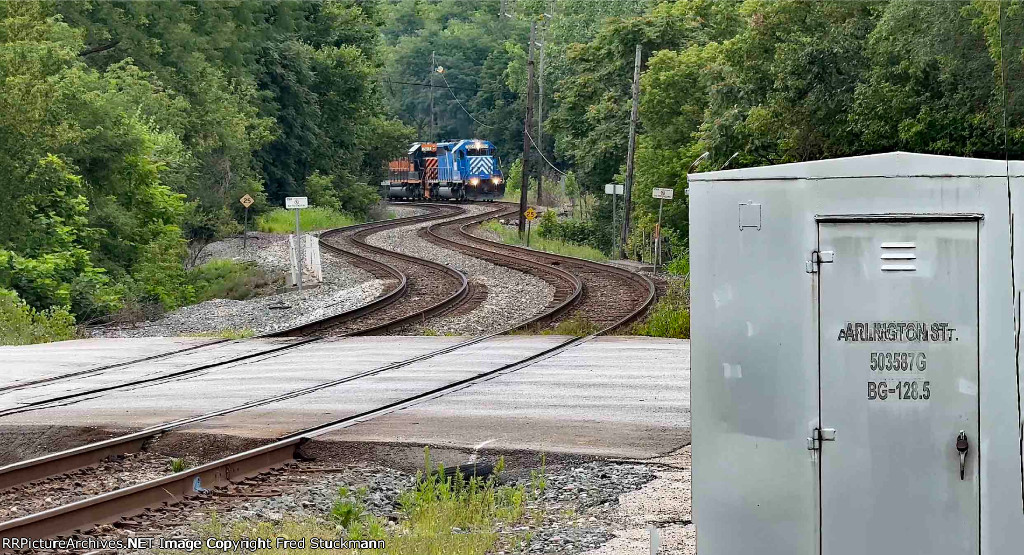 WE 7004 now heads west on 2 track.